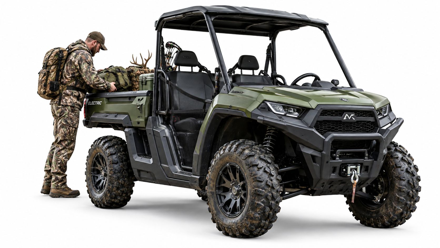 A person in camouflage gear loading a green electric utility task vehicle against a plain white background.