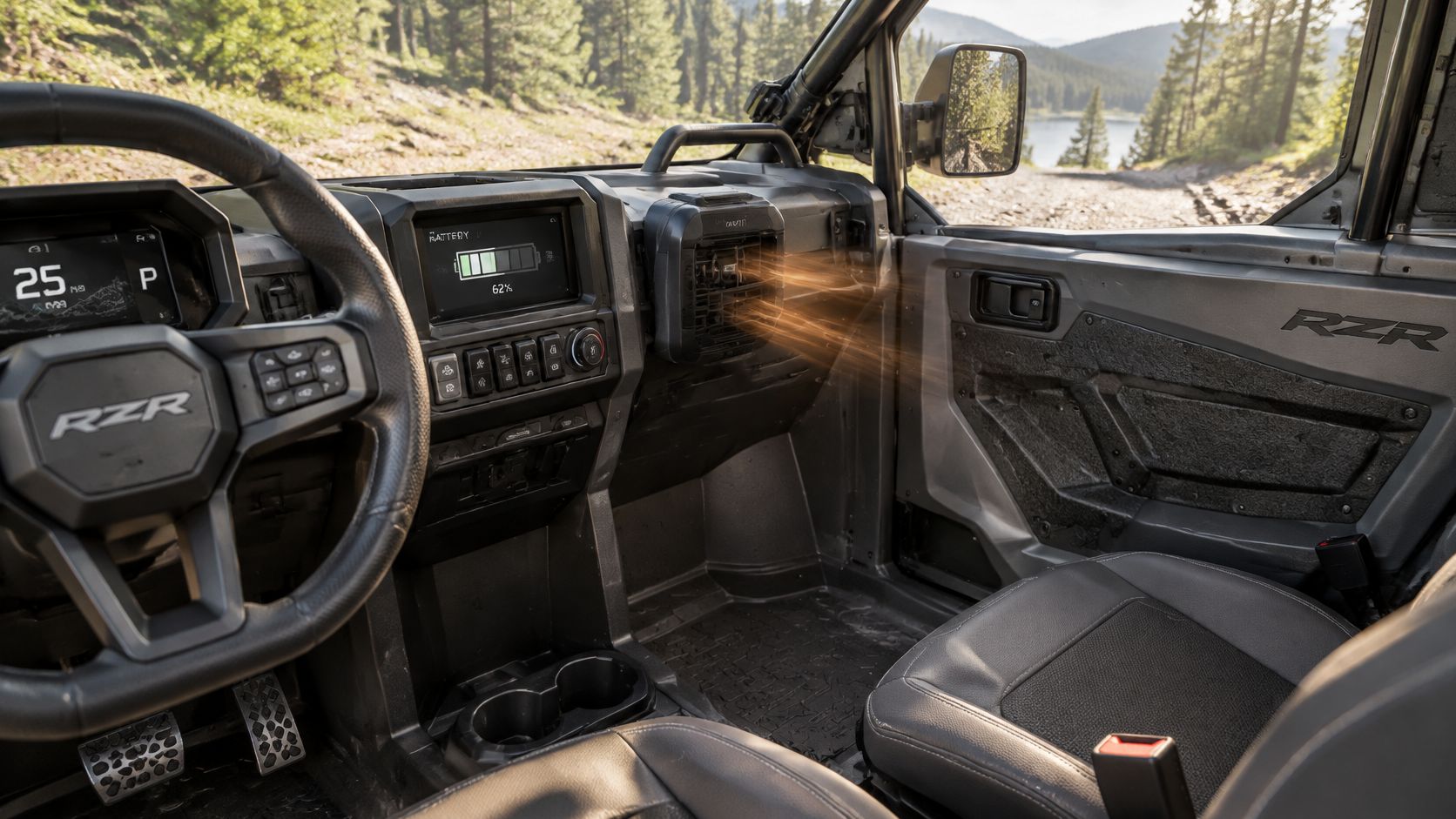Interior view of a RZR side by side vehicle featuring a heater fan unit blowing warm air.
